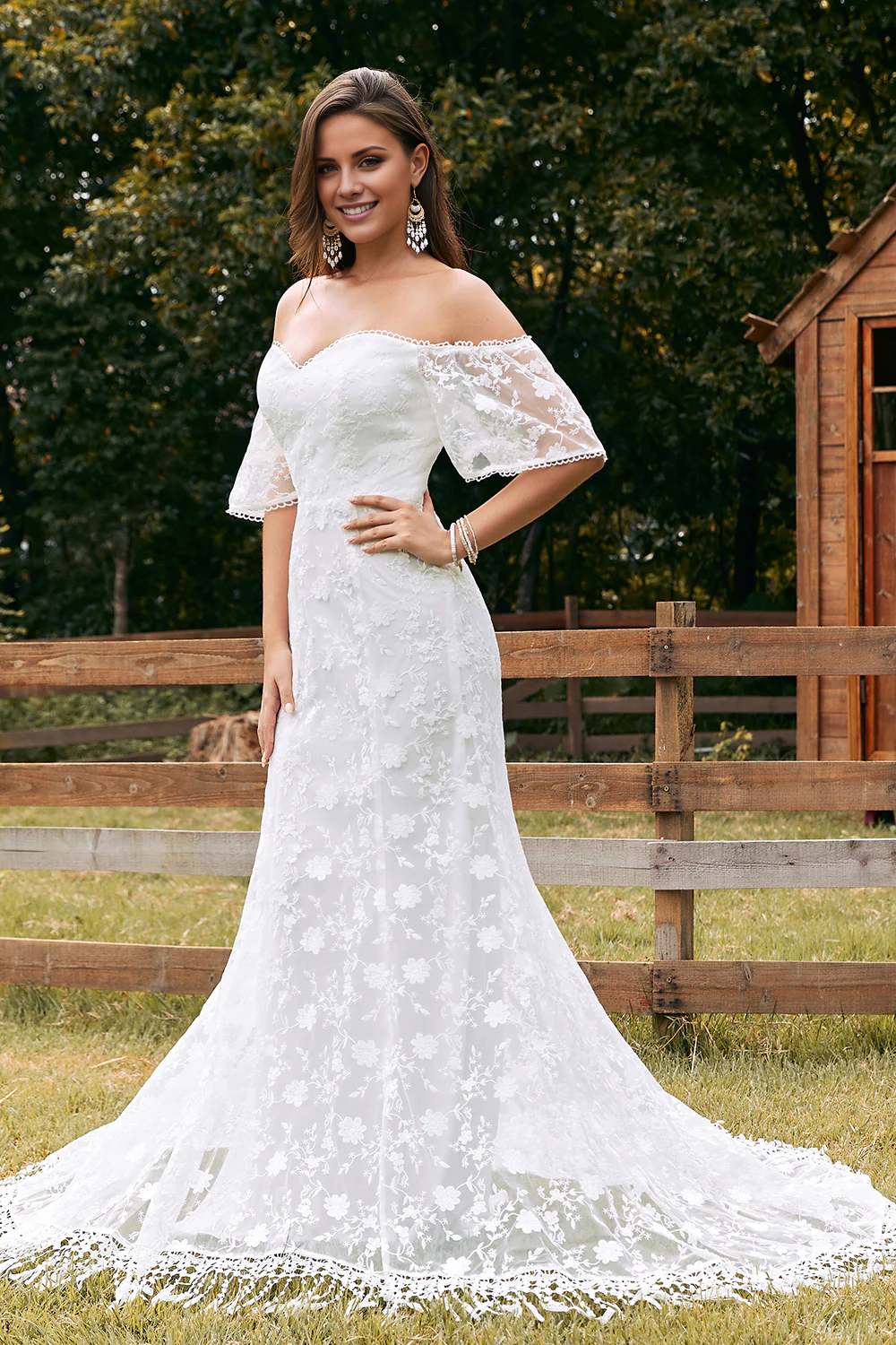 Ivory fish tail trailing lace and floor length wedding dress