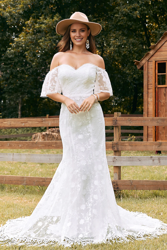 Ivory fish tail trailing lace and floor length wedding dress