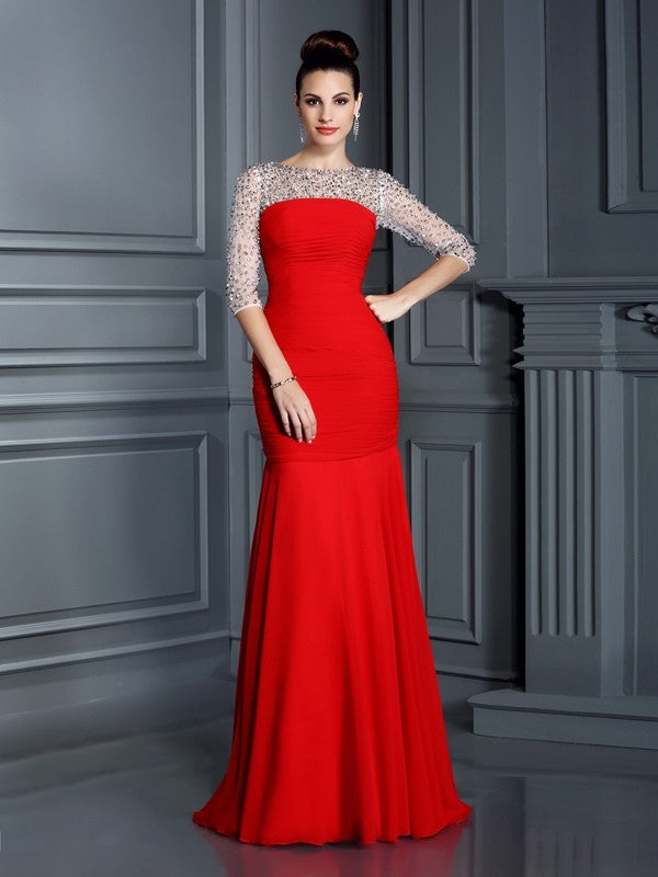 Robe longue en mousseline de soie, manches 3/4, décolleté trompette/sirène, perles