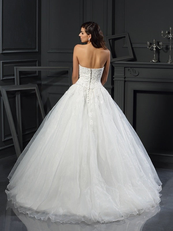 Robe de mariée longue en tulle, sans manches, décolleté en cœur, perles