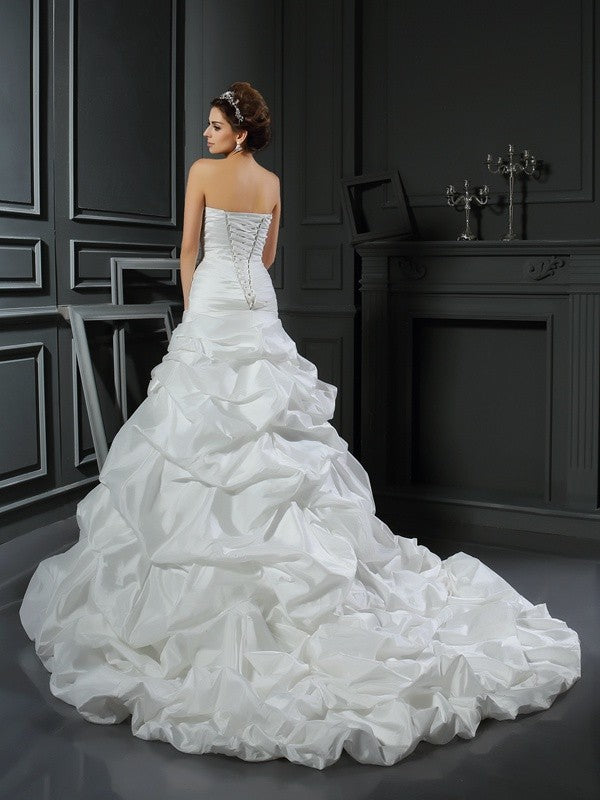 Robe de mariée longue en taffetas, sans manches, avec décolleté en cœur et fleurs faites à la main