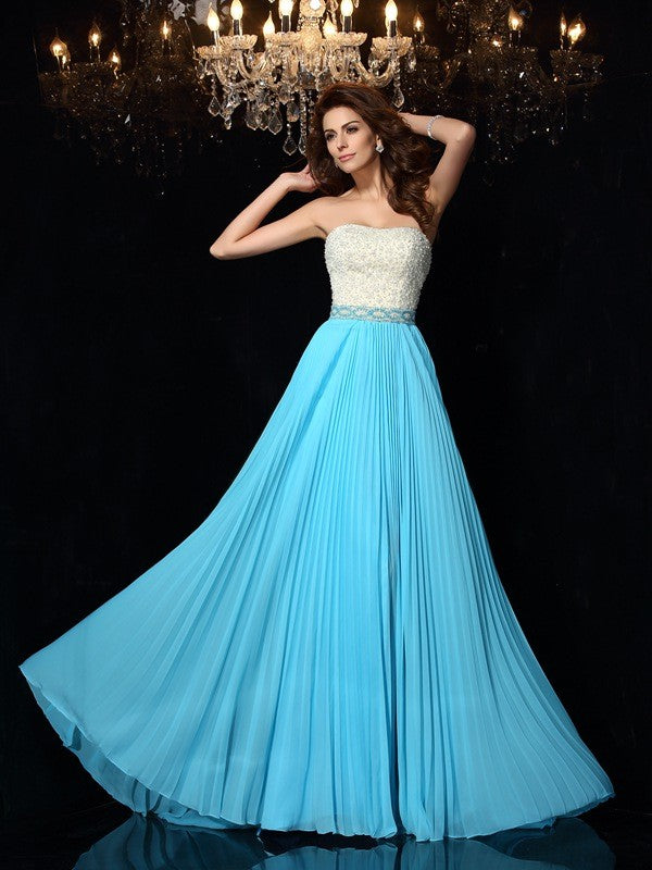 Robe longue en mousseline de soie, coupe trapèze/princesse, sans bretelles, avec perles, sans manches