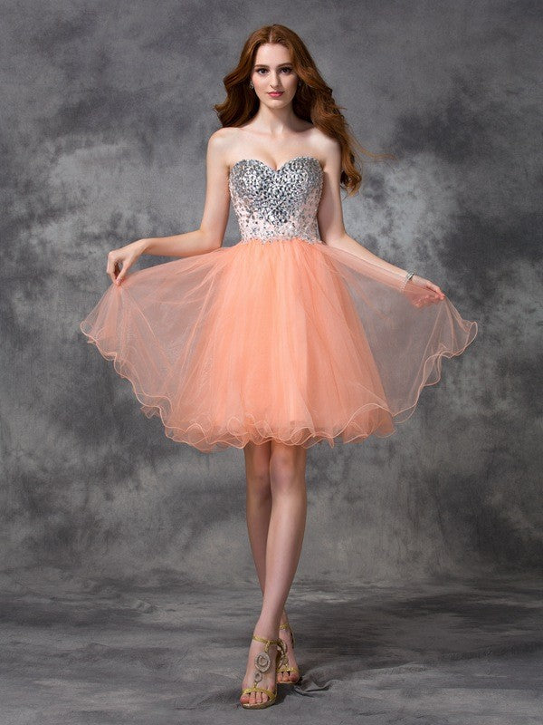 Robe de cocktail courte en tulle, coupe trapèze/princesse, bretelles spaghetti, perles, sans manches