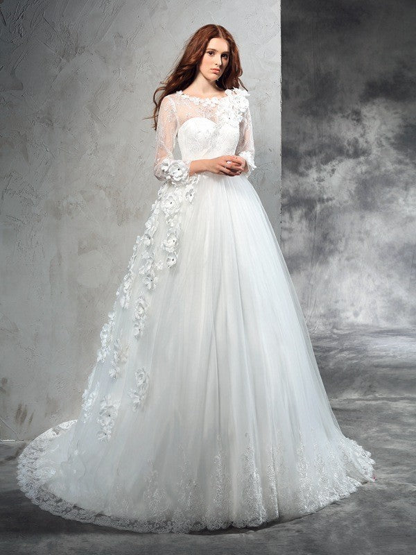 Robe de mariée longue en tulle, col transparent, manches longues, fleurs faites à la main