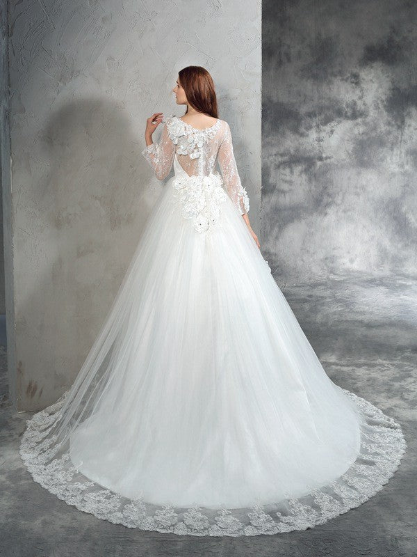 Robe de mariée longue en tulle, col transparent, manches longues, fleurs faites à la main