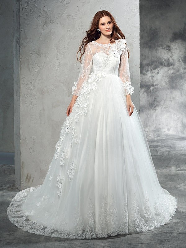 Robe de mariée longue en tulle, col transparent, manches longues, fleurs faites à la main