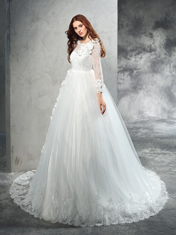 Robe de mariée longue en tulle, col transparent, manches longues, fleurs faites à la main