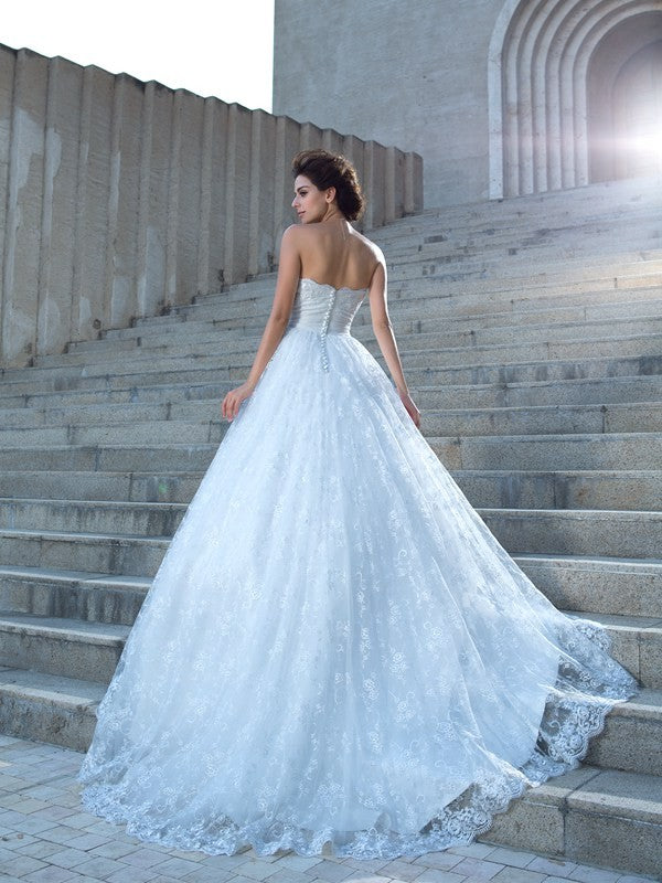 Robe de mariée longue en dentelle, décolleté en cœur, sans manches