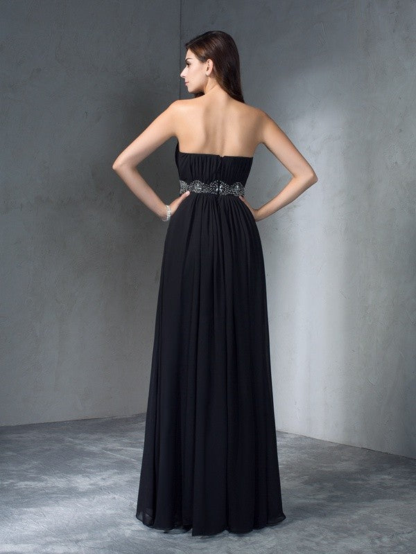 Robe longue en mousseline de soie, coupe trapèze/princesse, sans bretelles, avec perles, sans manches