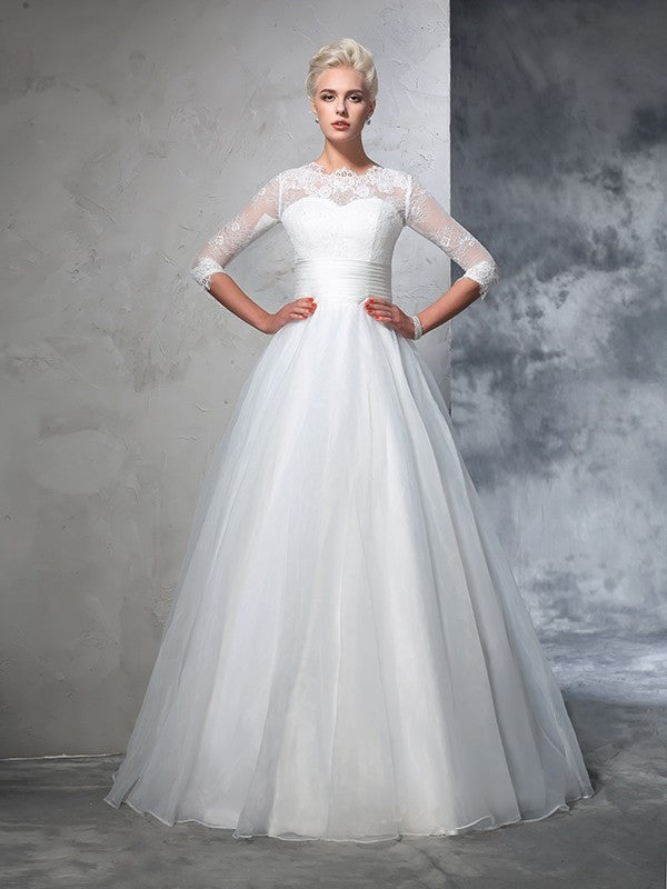 Robe de mariée longue en organza, manches 3/4, avec appliques et bijoux