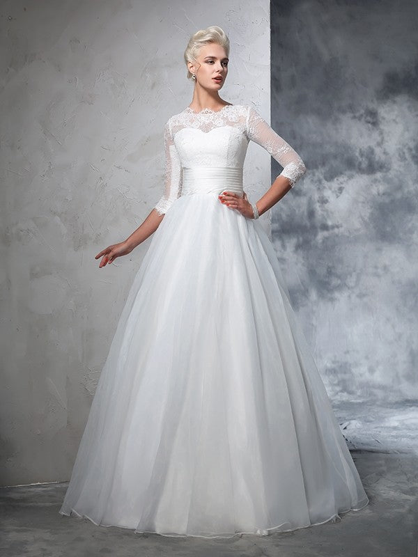 Robe de mariée longue en organza, manches 3/4, avec appliques et bijoux
