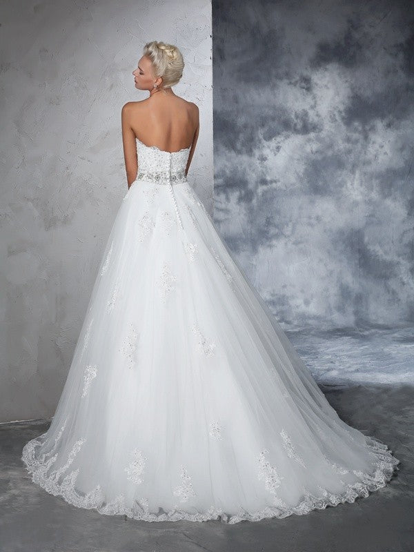 Robe de mariée longue en filet, sans manches, décolleté en cœur, avec appliques