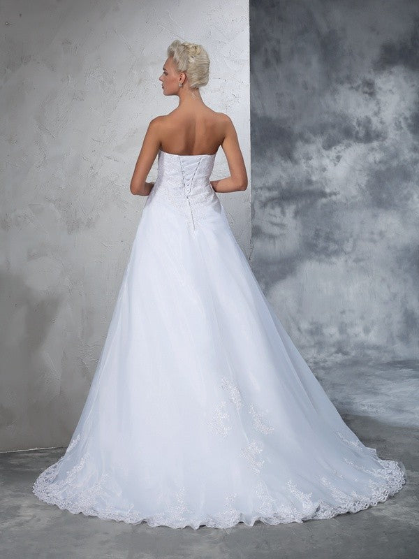 Robe de mariée longue en filet, sans manches, avec appliques et bretelles