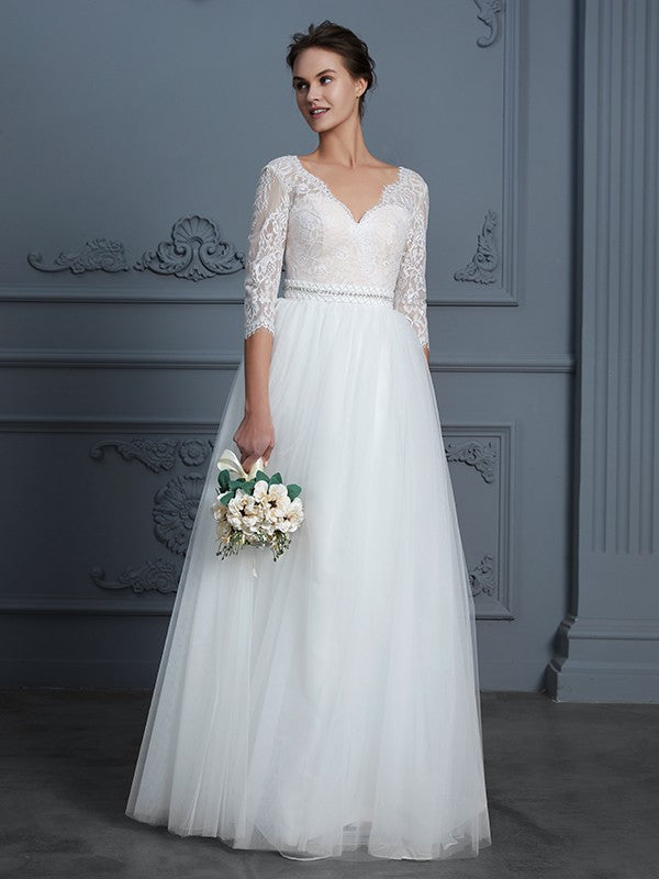 Robe de mariée trapèze/princesse, col en V, manches 3/4, longueur au sol, en dentelle et tulle