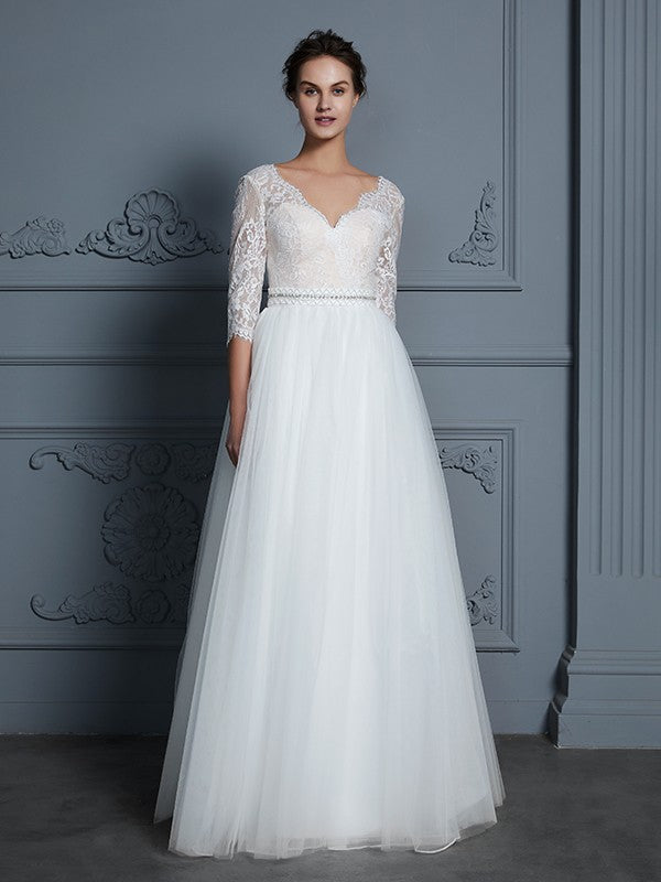 Robe de mariée trapèze/princesse, col en V, manches 3/4, longueur au sol, en dentelle et tulle