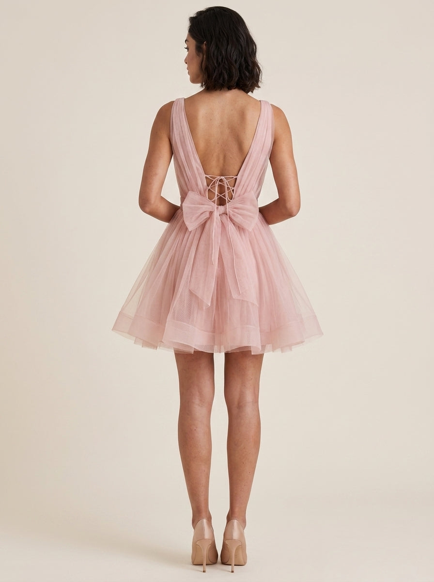 Back view of the blush tulle homecoming dress, showcasing the lace-up detail.