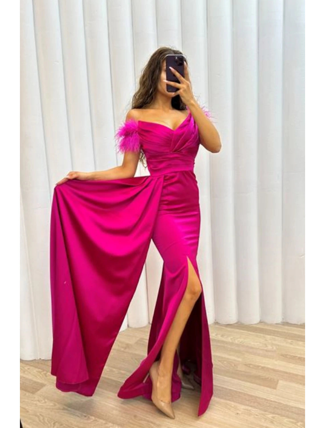 Back view of the A-line off-shoulder satin gown, showing the sweep train.