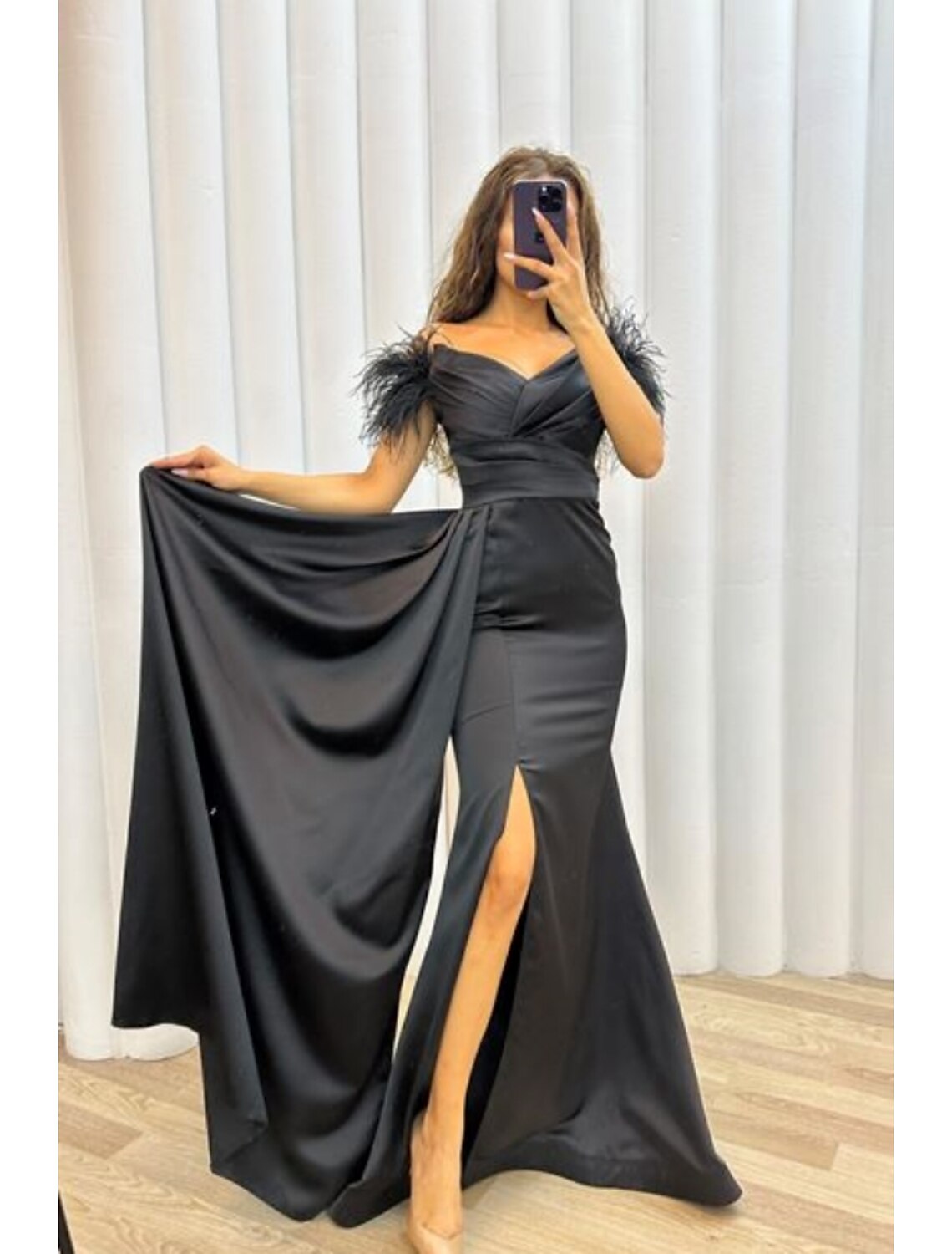 Model in the A-line satin gown, showing short sleeves and off-shoulder design.