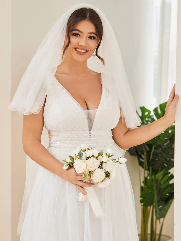 Robe de mariée trapèze taille empire sans manches en dentelle transparente 