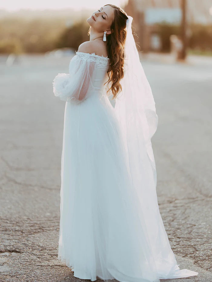 Robe de mariée transparente à manches lanternes et épaules dénudées 