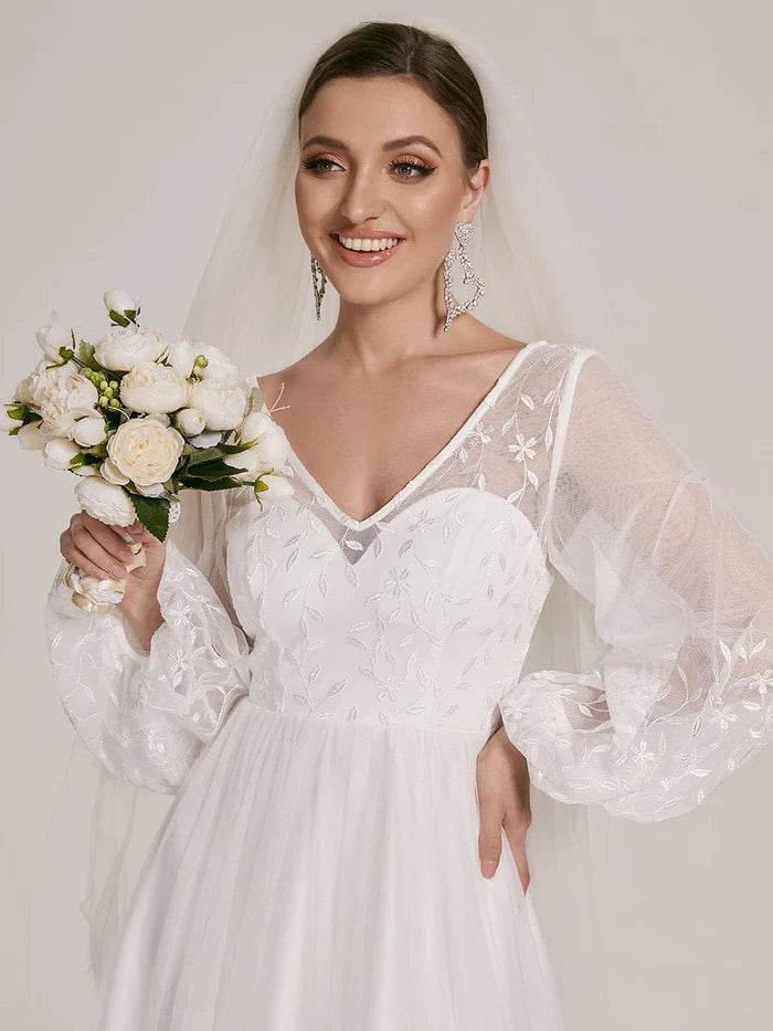 Robe de mariée trapèze à manches bouffantes et à fleurs transparentes 