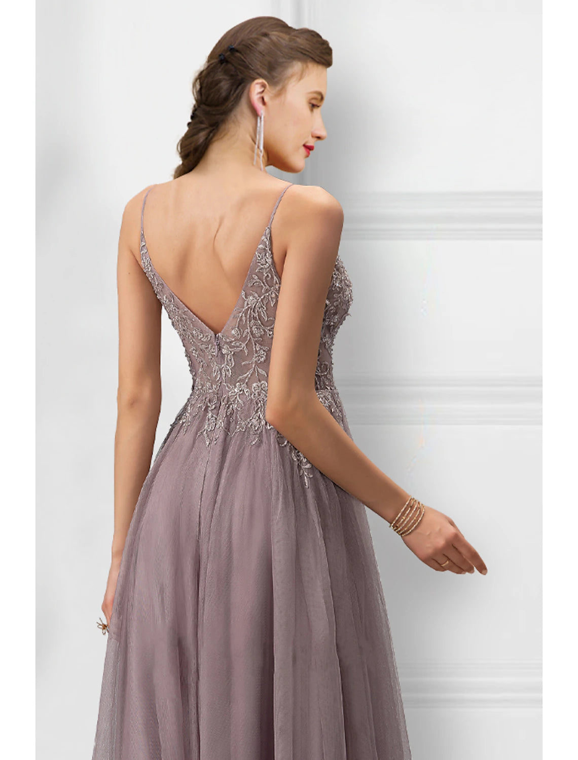 Back view of elegant A-line floral tulle prom dress with delicate spaghetti straps.