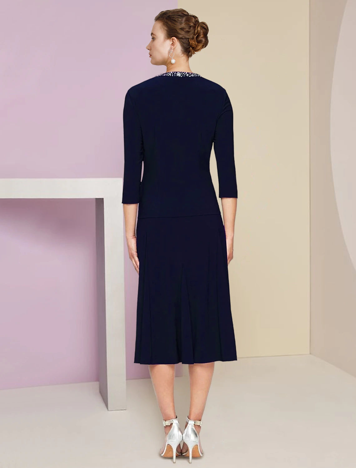 Back view of the elegant A-Line knee length dress with 3/4 sleeves.