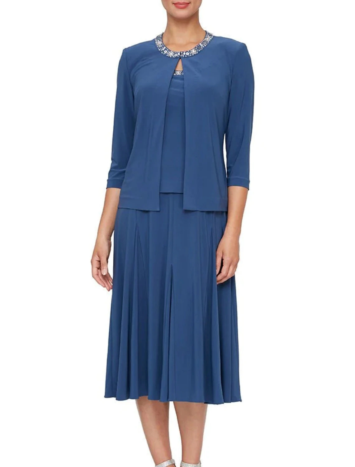 Side view of the A-Line dress, showing pleated details and crystal embellishments.