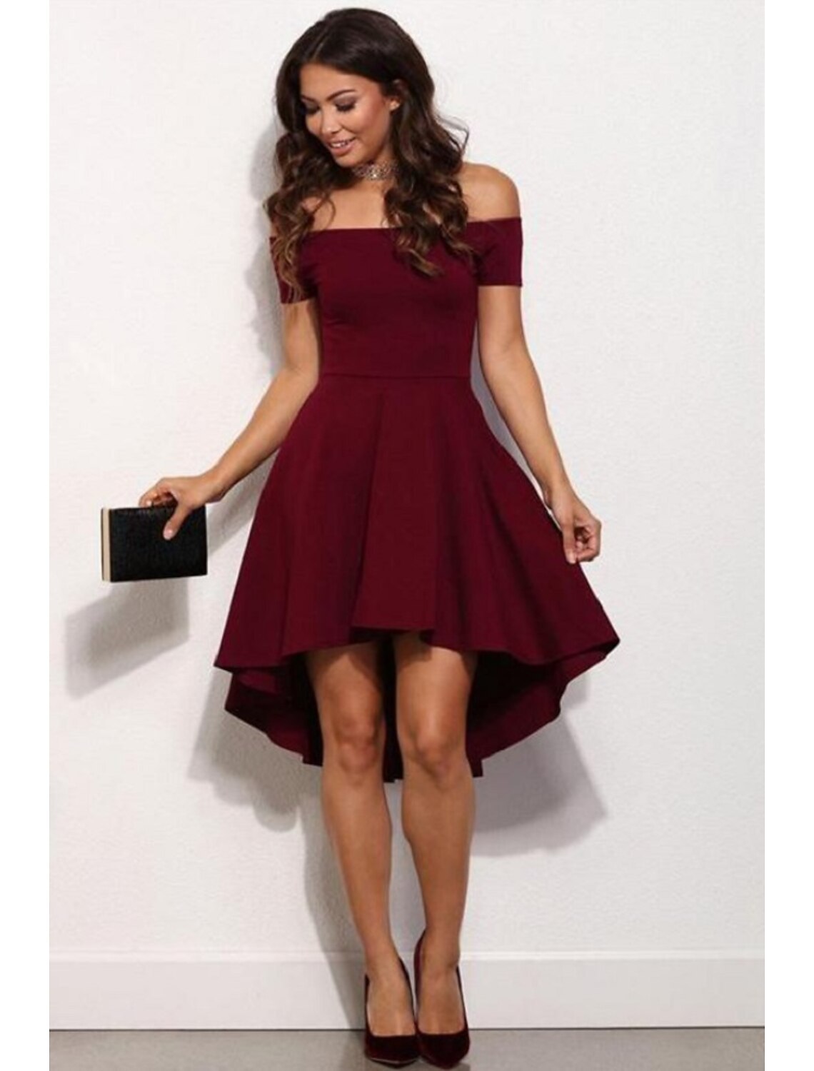 Model posing in an elegant A-line off-shoulder short sleeve satin mini homecoming dress.