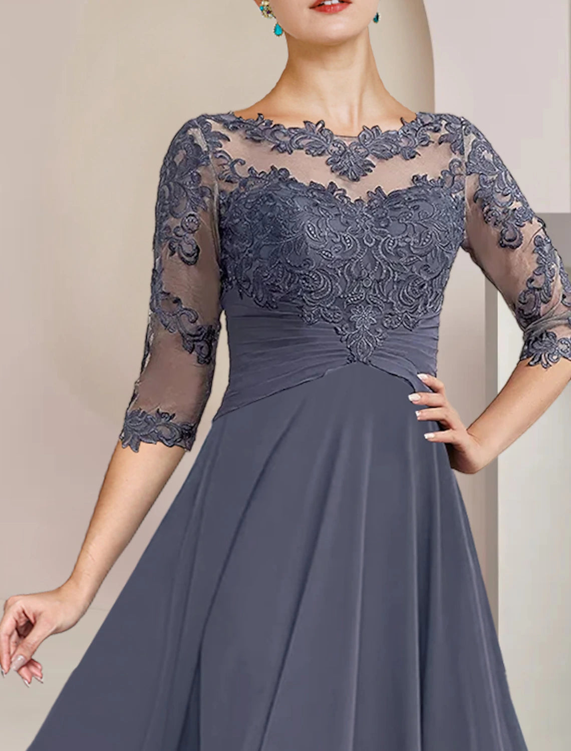 Two-piece elegant tea length dress featuring chiffon lace details.