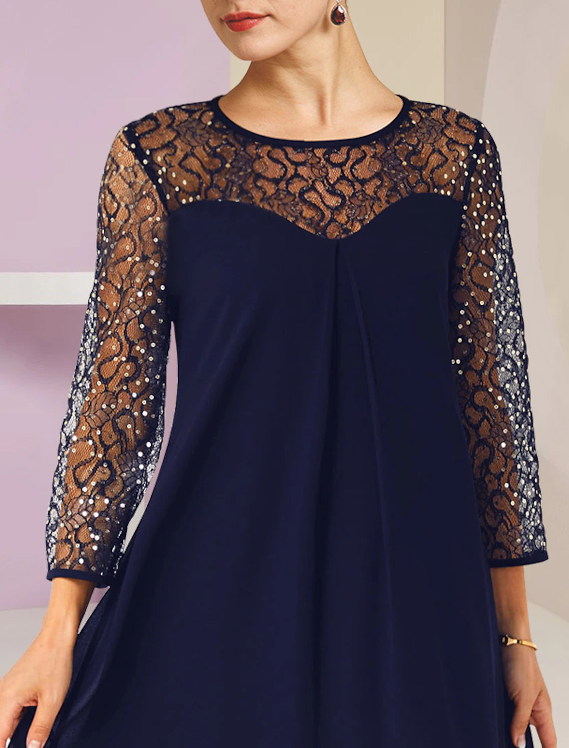 Back view of an A-line scoop neck lace sequin formal dress.