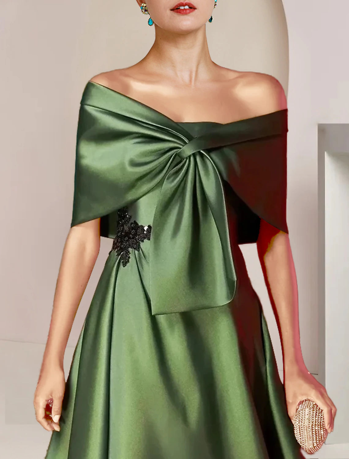 Side view of the elegant A-Line tea-length charmeuse dress.