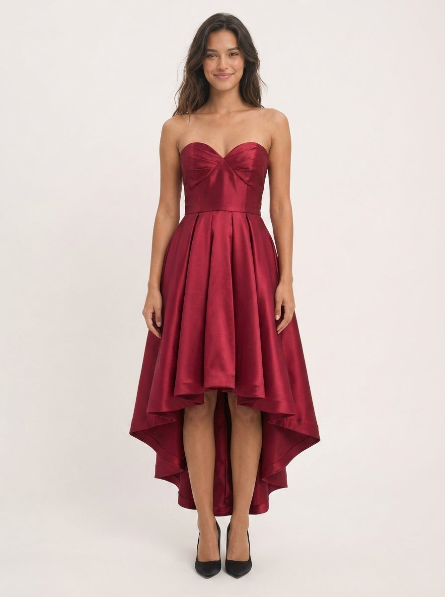 Side profile of the elegant burgundy satin homecoming dress.