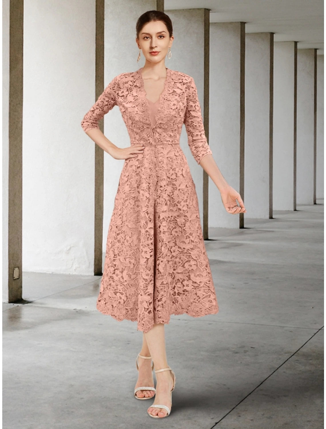 Woman wearing an elegant A-line V-neck 3/4 sleeve ruched chiffon dress.