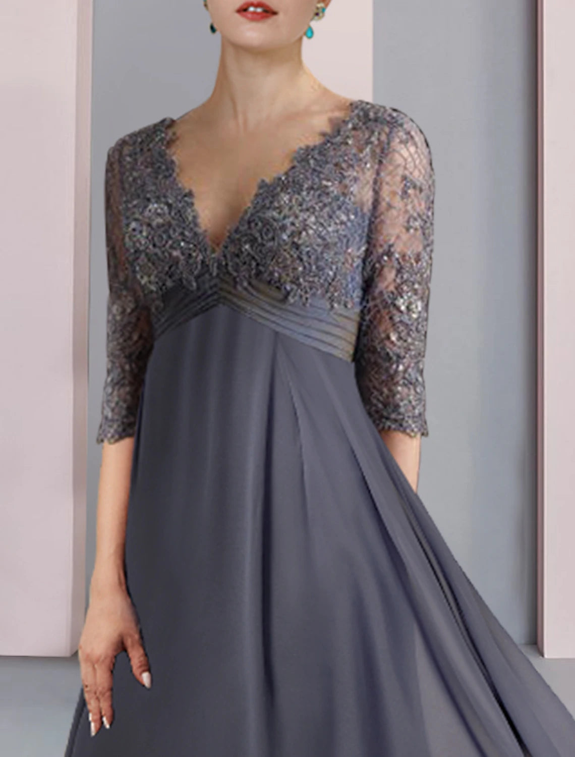 Back view of the elegant A-line V-neck half sleeve tea length Mother of the Bride dress, showing lace and appliques.