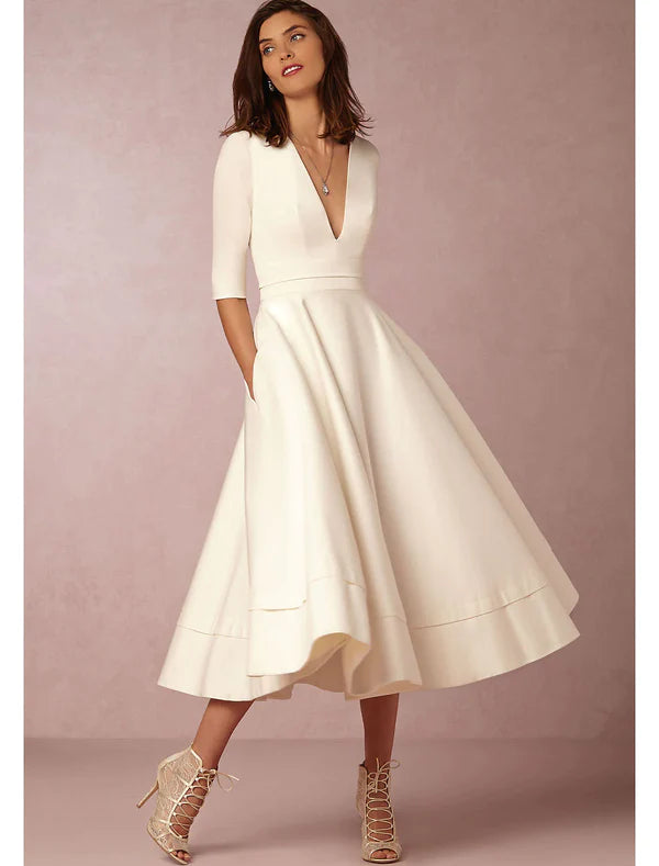 Elegant A-Line V-neck half sleeve tea length party dress with pleats and pockets.