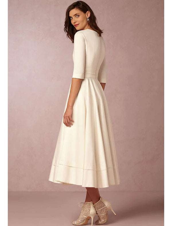 Back view of the elegant A-Line V-neck half sleeve tea length party dress.