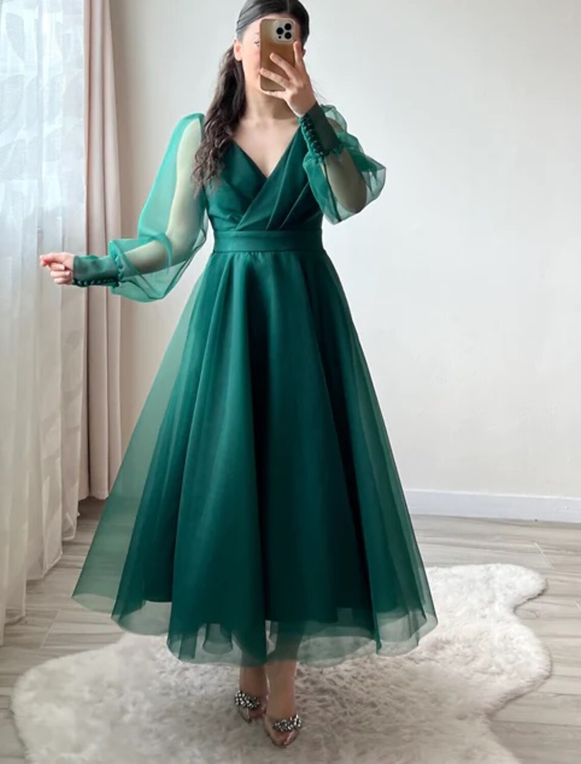 Sophisticated tea length A-line dress in organza fabric.