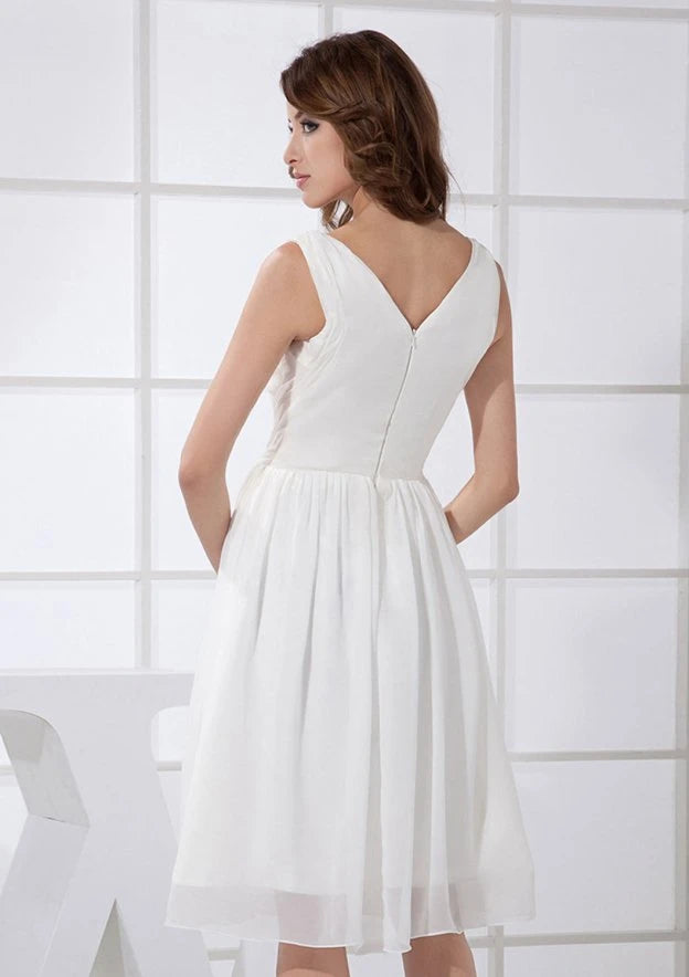 Elegant A-Line V-Neck Pleated V-Back White Knee-Length Homecoming Dress.