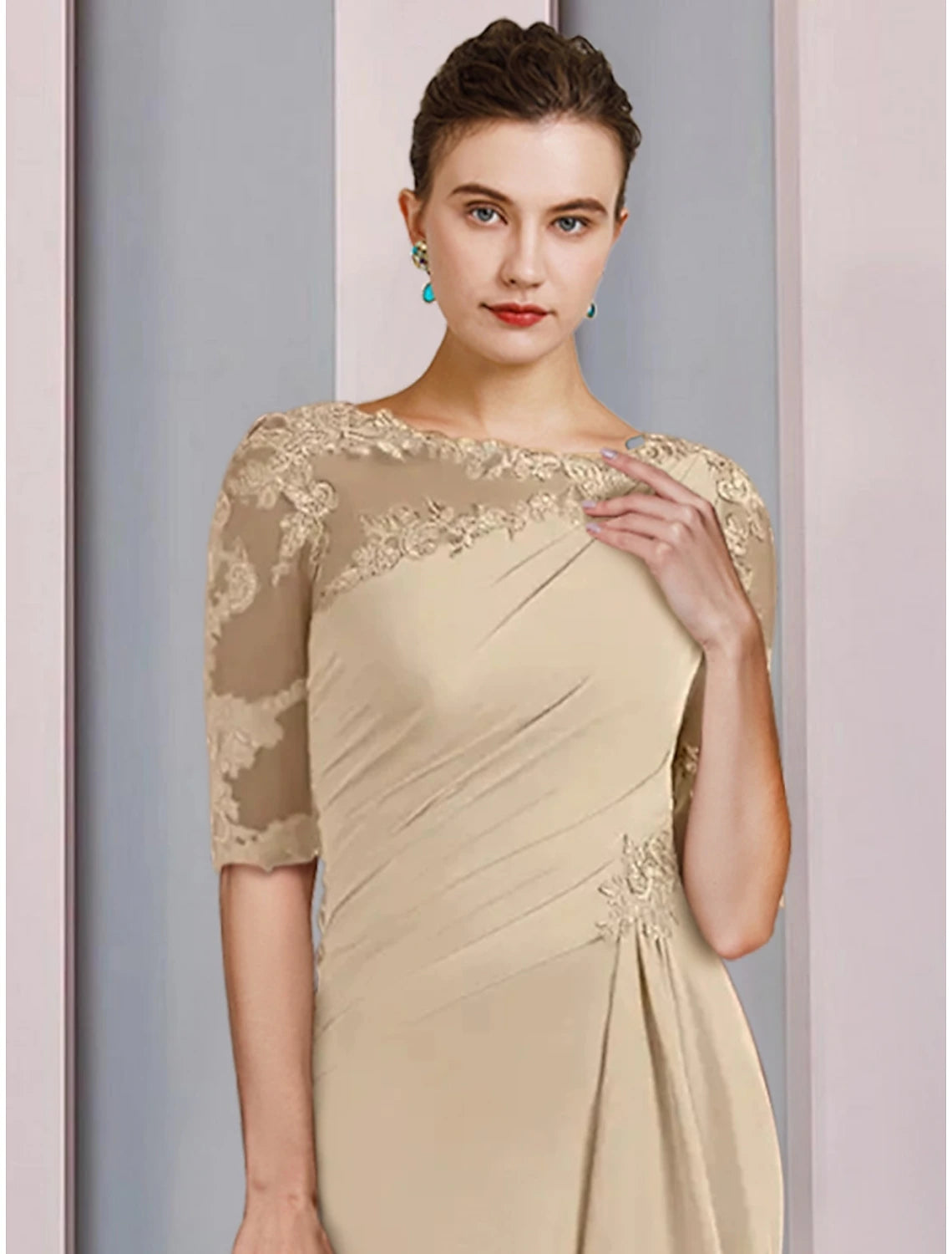 Back view of the floor-length mother of the bride dress, highlighting ruching details.