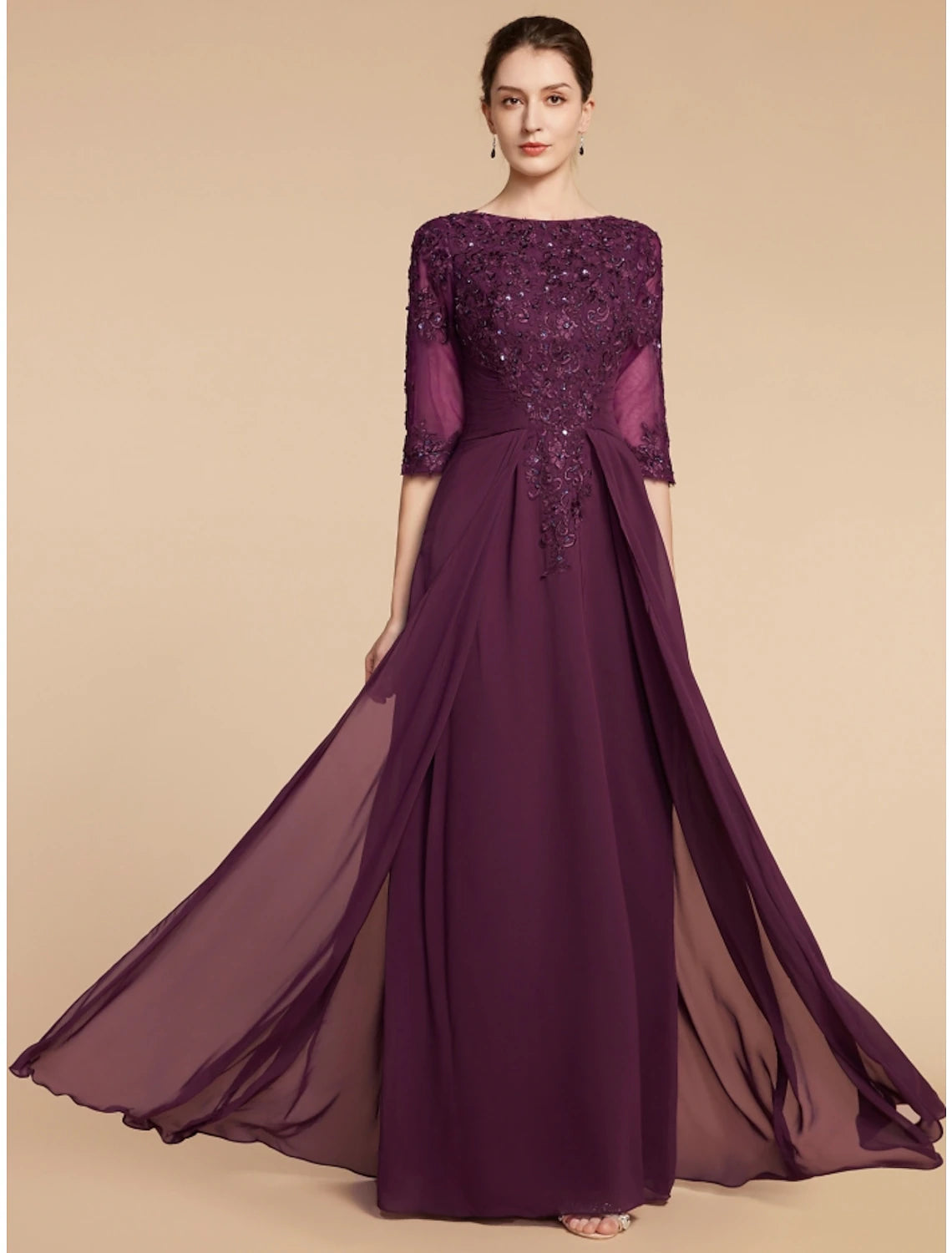 Elegant mother of the bride gown with scoop neck and half sleeves.