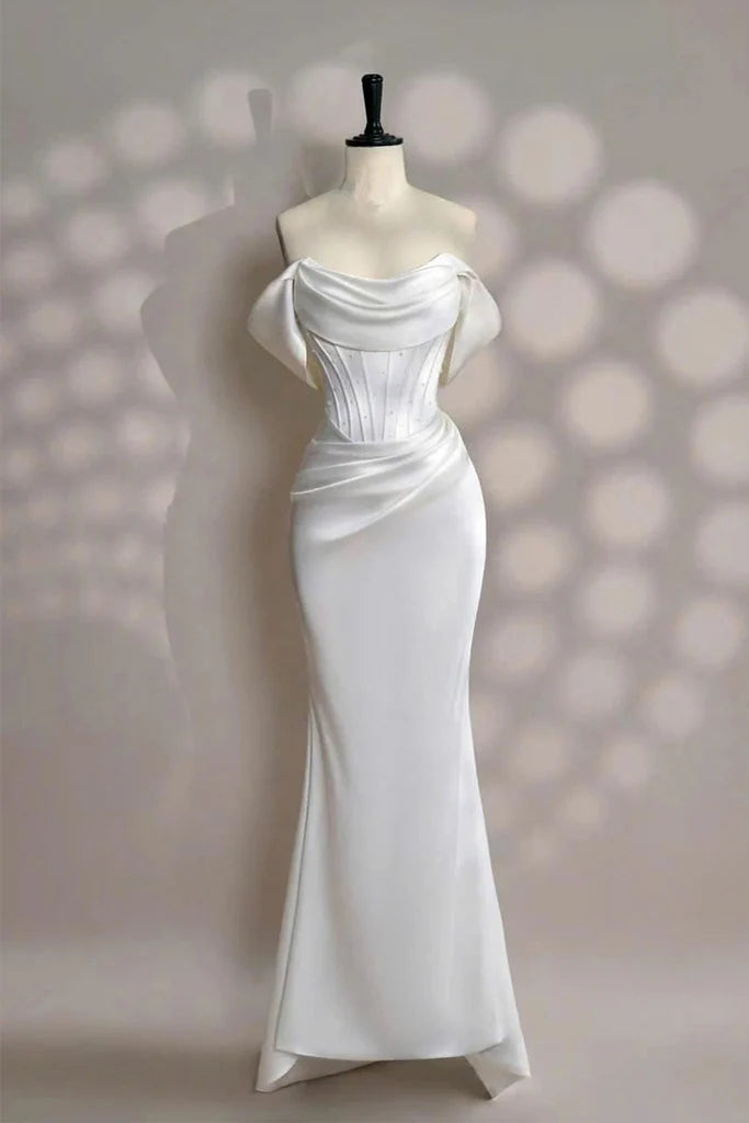 Elegant satin mermaid off the shoulder cowl neck floor length evening dress with beaded corset bodice, draped skirt, oversized bow back and lace up detail
