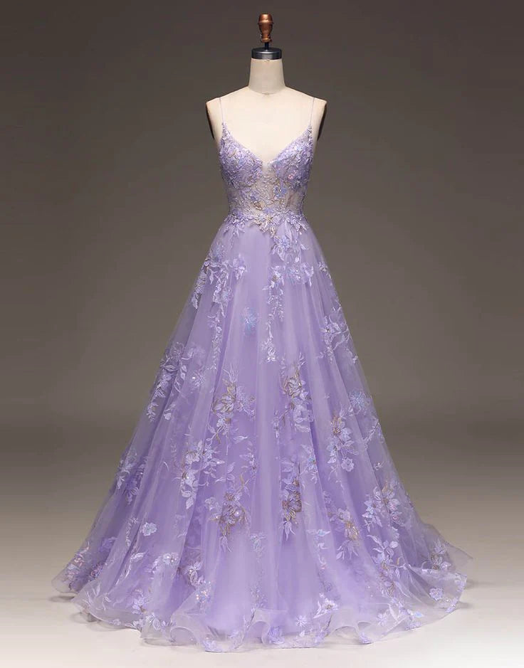 Enchanting lavender tulle prom dress with spaghetti straps, V-neck, beaded floral appliqués, and A-line skirt