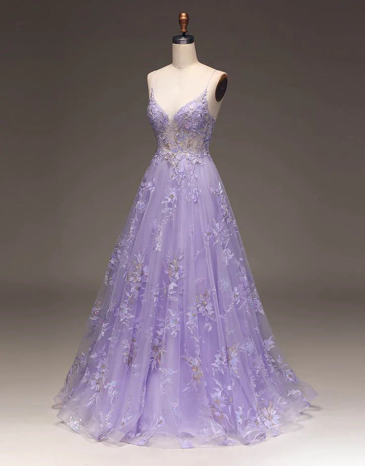 Enchanting lavender tulle prom dress with spaghetti straps, V-neck, beaded floral appliqués, and A-line skirt