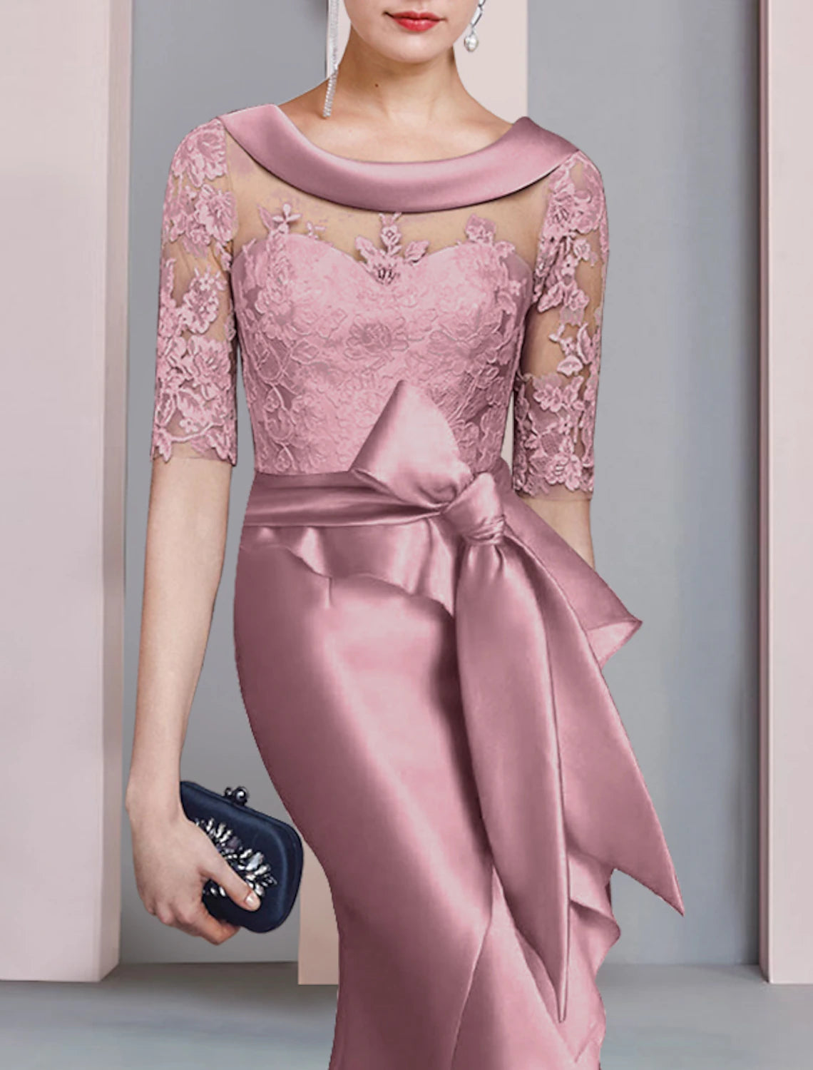 Close-up of the scoop neck and half sleeves of the formal mermaid trumpet dress with satin lace.