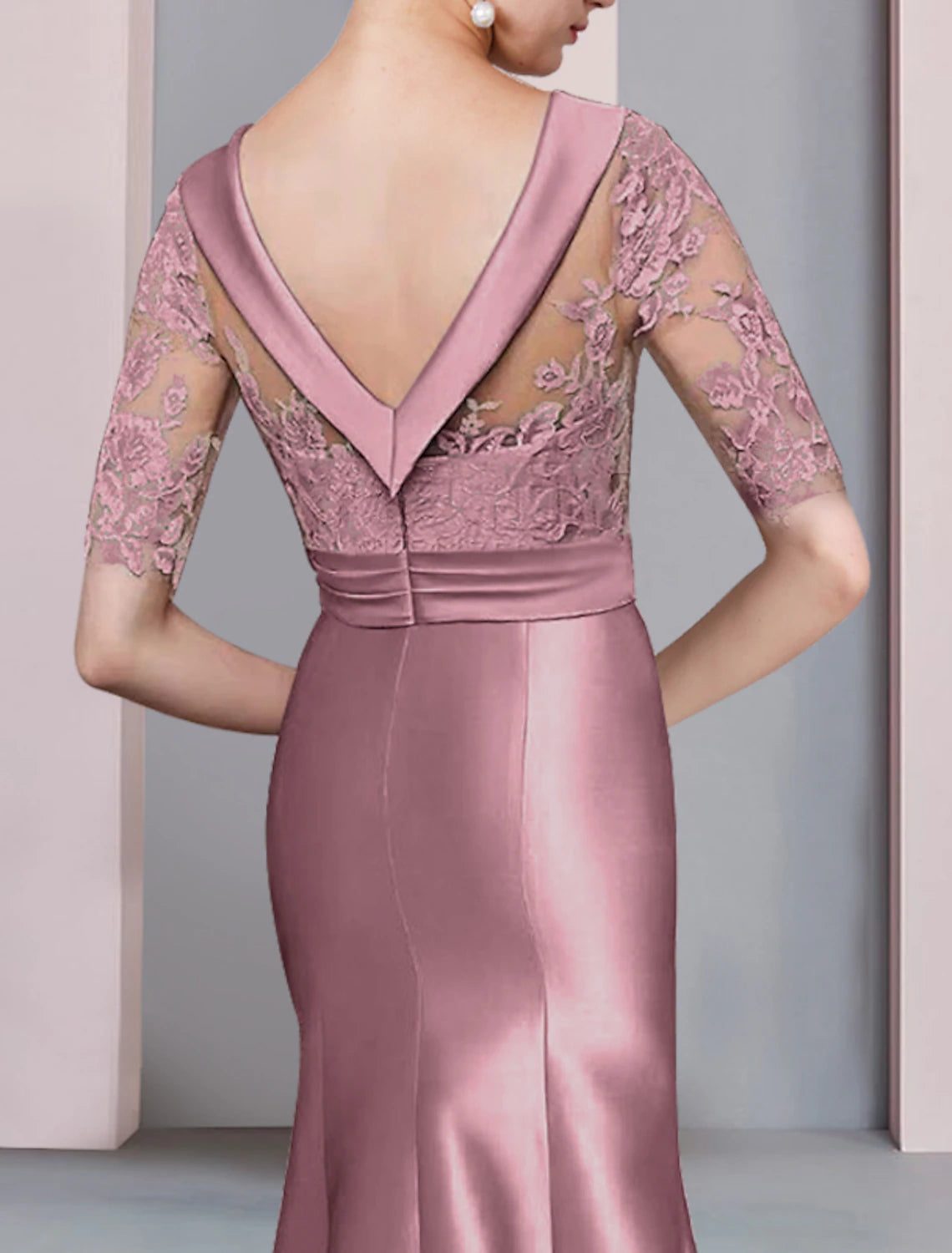 Full-length view of the formal mermaid trumpet dress, emphasizing its elegant high-low asymmetrical style.