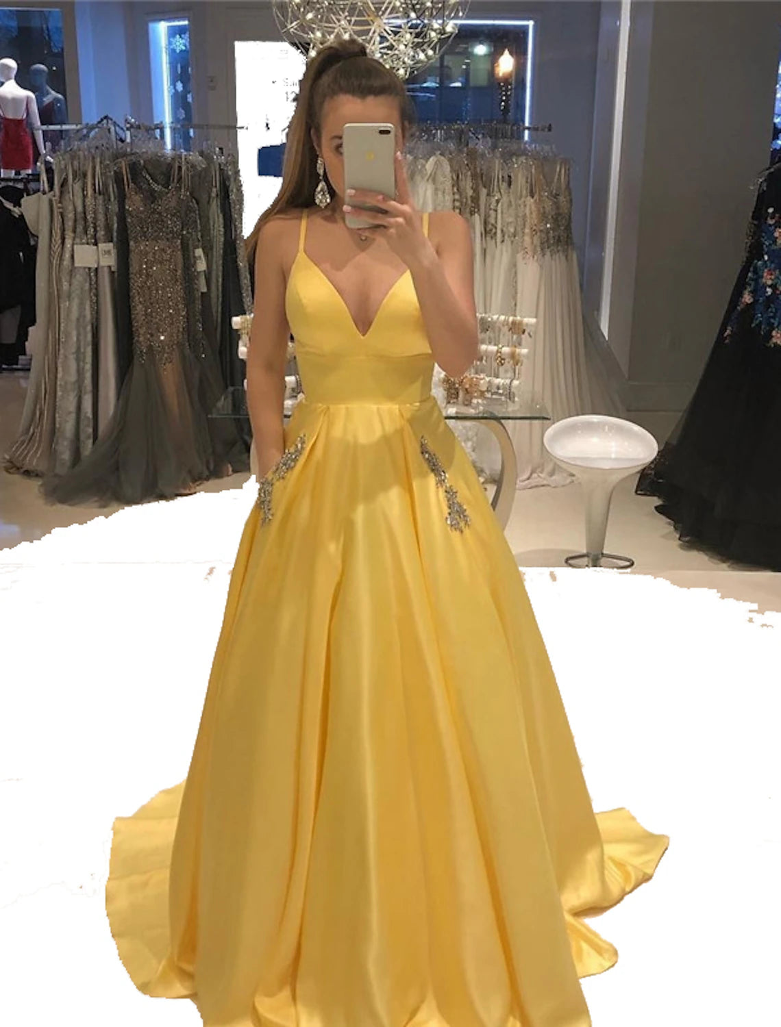 Model wearing a glamorous A-Line V-neck satin evening gown with beading.