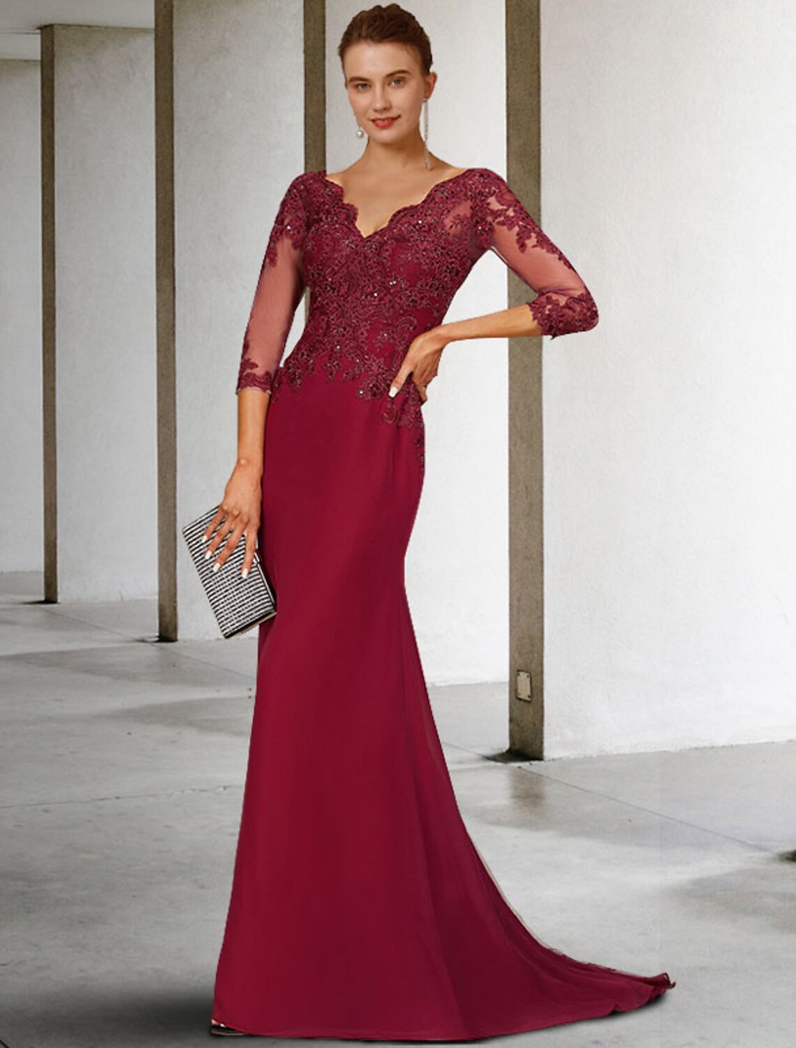 Luxurious mermaid mother of the bride dress with V-neck and 3/4 sleeves, featuring lace and sequin details.