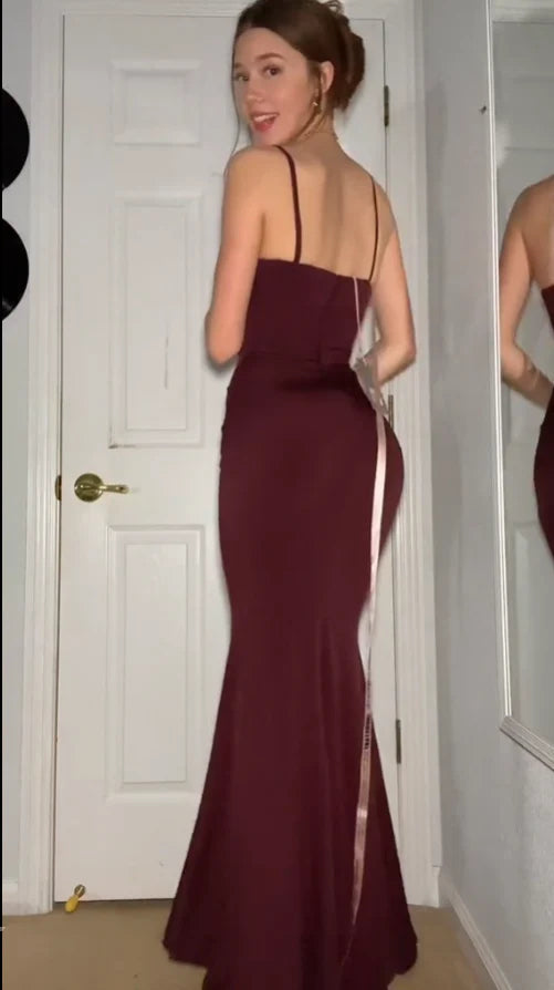 Sleek burgundy jersey prom dress with spaghetti straps, square neck, and mermaid skirt