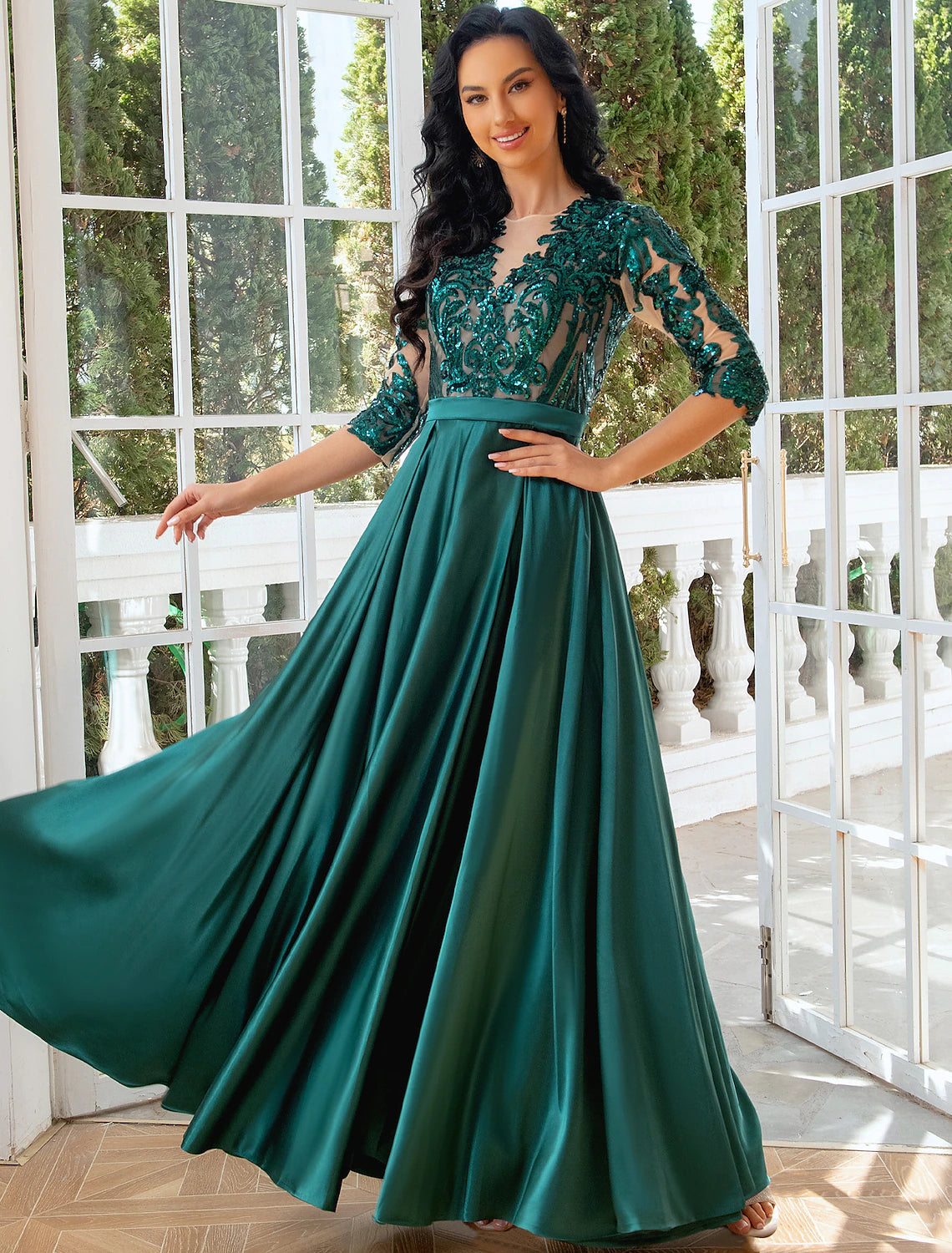 Side view of model in A-line gown, highlighting the sequin slit.